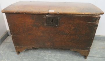 A 17th century oak six plank joined coffer of good colour, having an internal candle box, on stile