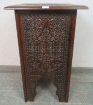 An Anglo-Indian antique hardwood occasional table, having well carved geometric decoration, with