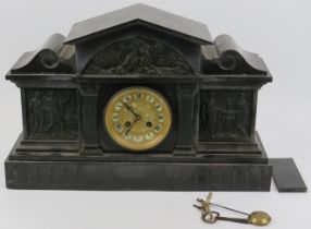 A Victorian black slate and marble mantel clock. The case applied with black painted bronze