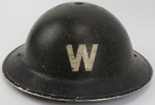 A World War II British civil defence air raid wardens steel brodie helmet. Painted black with a