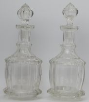 A pair of Victorian clear faceted glass decanters with stoppers. (2 items) 30.8 cm height. Condition