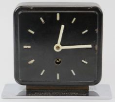 Bauhaus school: A black and white enamelled steel table clock designed by Marianne Brandt for