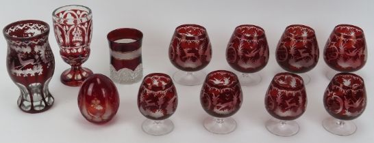 A group of European flash and overlay ruby glass items. Comprising nine German engraved glasses