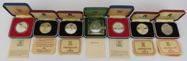 Seven British Royal Mint and Pobjoy Mint silver coins, 20th century. Presentation boxes and