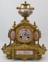 A French ormolu and painted porcelain mantle clock, 19th century. Modelled in the Neoclassical style
