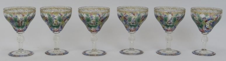 A set of six European Bohemian polychrome painted and engraved wine glasses. Decorated with