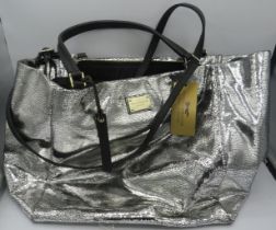 A large Paul Costelloe handbag with silver crackle metallic decoration and added shoulder strap,