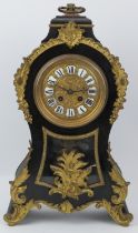 A large French gilt metal mounted and ebonised wood mantle clock, 19th century. With enamelled Roman