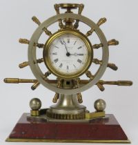 A French ship’s helm marine presentation clock, Paris, 19th century. Modelled as a twelve spoke