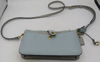 A Coach two tone leather phone/cards crossbody bag. New York. Condition report: Good condition,