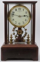 An Edwardian Eureka Clock Company electro magnetic mantel clock, dated 1906. The enamelled dial with