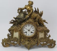 A French Louis XV revival ormolu and alabaster mantel clock, 19th century. The enamelled white