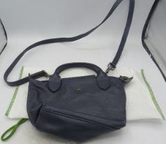 A small Longchamp navy leather bag with shoulder strap. Condition report: Good condition.