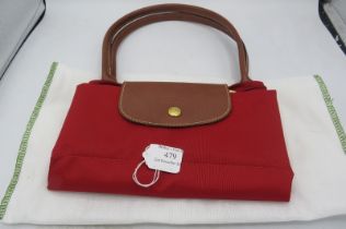 A Longchamp Tote Le Pliage (folding bag) in red canvas. Condition report: Good condition.