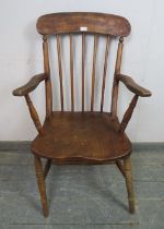 A late 19th/early 20th century elm and beech Windsor armchair.