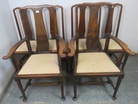 A set of 6 Queen Anne style oak dining chairs, c.1900, comprising two carvers and four singles,