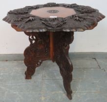 A well-carved early 20th century Anglo Indian octagonal table, the top depicting fruiting vines