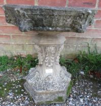 A nicely weathered reconstituted stone bird bath on pedestal base, 20th century. H52cm Diameter 51cm