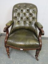 A Victorian open-sided mahogany library chair, upholstered in nicely worn buttoned green leather