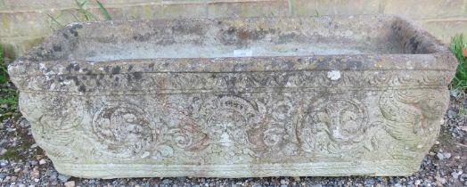 A nicely weathered reconstituted stone plant trough, relief moulded with classical motifs. W72cm