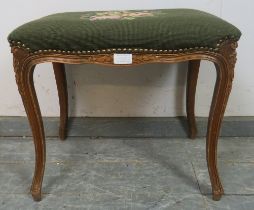 An antique style French fruitwood dressing stool, having a green tapestry seat with brass studs,