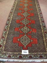A North West Persian Senneh runner, thick weave with a central repeat pattern, 305 cm x 0.90cm.