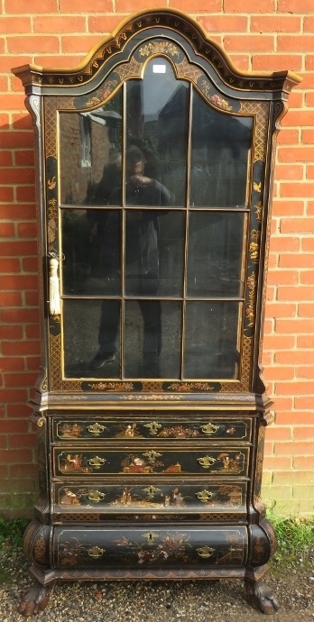 A 19th century Continental ebonised display cabinet, having chinoiserie motifs with gold accents,