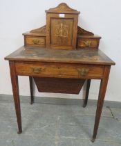 An Edwardian rosewood ladies writing desk, having marquetry inlay and satinwood strung, the upper