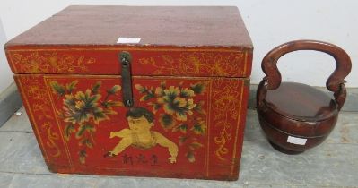 An Eastern chinoiserie decorated red lacquered storage box, 20th century, 44cm wide x 32cm high x
