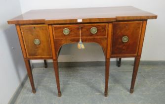 An elegant George III satinwood banded mahogany breakfront sideboard, the central frieze drawer