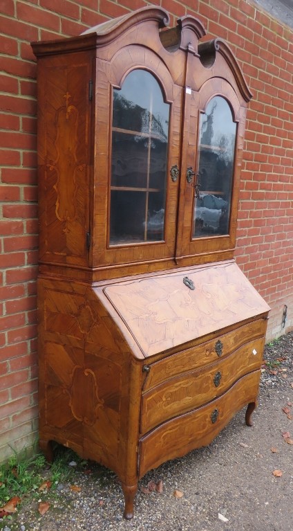 A large 18th century Continental marquetry bureau bookcase, having a broken and scrolled pediment - Image 2 of 4