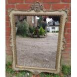 A decorative period-style wall mirror, 20th century, relief moulded decoration, gilt and paint
