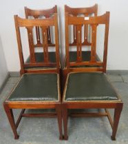 Four Arts & Crafts mahogany dining chairs by Maple & Co, having pierced backrests and seats