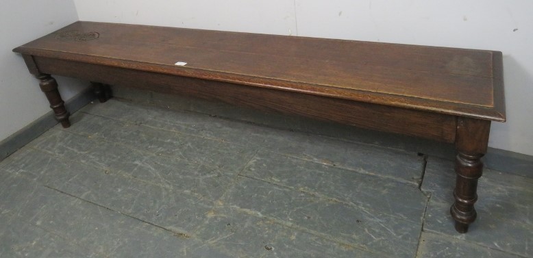 An unusually long 19th century oak hall bench/window seat, carved decoration to one end of seat, - Image 2 of 3
