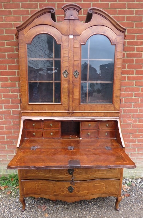 A large 18th century Continental marquetry bureau bookcase, having a broken and scrolled pediment - Image 4 of 4