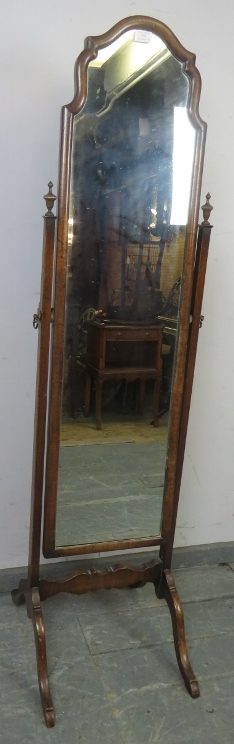 A turn of the century walnut cheval mirror, within a shaped surround, the uprights with turned - Image 2 of 2