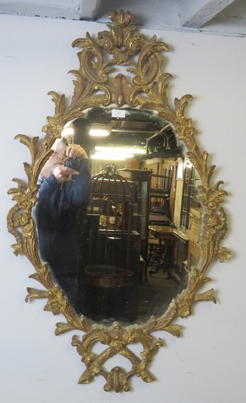 A highly decorative Georgian revival carved giltwood wall mirror, 20th century, decorated with - Image 3 of 3