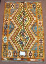 A fine Chobi Kilim rug, central interlocking diamond pattern with strong colours and good condition.