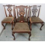 A set of four vintage Chippendale Revival mahogany dining chairs, comprising one carver and three