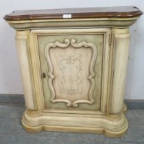 A small decorative reproduction side cupboard in the 18th century French taste, the shaped