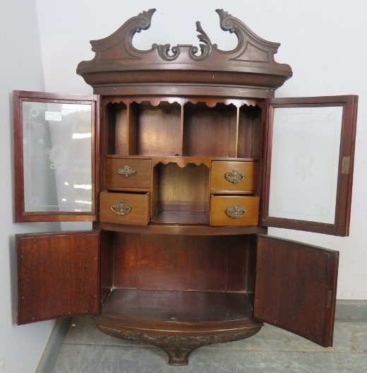 An Edwardian ornately carved mahogany bow front hanging wall cabinet, shaped pediment above etched - Image 2 of 3