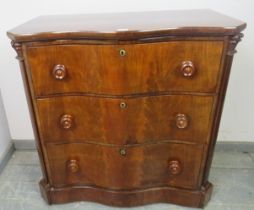 A 19th century serpentine fronted feathered mahogany chest of three long graduated drawers, turned