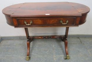 A Regency Period style feathered mahogany side table, 20th century, the cross-banded rectangular top