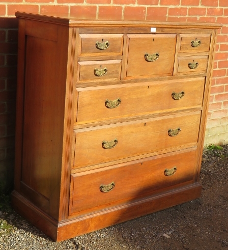 A turn of the century walnut bedroom chest, the central hat drawer flanked by four short drawers, - Image 2 of 3