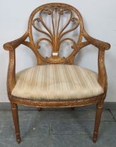 A vintage giltwood open-sided elbow chair in the Louis XV taste, the pierced back with scrolling