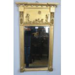 An English Regency period gilt gesso pier glass mirror of breakfront form with relief moulded