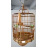 An Asian bamboo bird cage of decorative period design, 20th century. H56cm (approx).