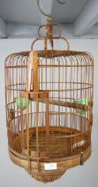 An Asian bamboo bird cage of decorative period design, 20th century. H56cm (approx).