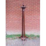 A late 19th century Aesthetic period walnut coat stand, in the manner of James Shoolbred. H206cm (