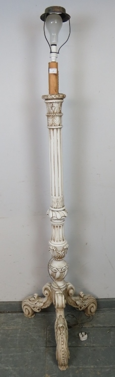 An ornate vintage standard lamp in the Florentine taste painted white, the fluted column on acanthus